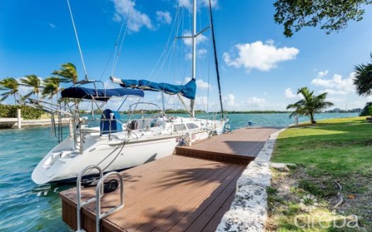 7 MILE BEACH CORRIDOR  3-BED  WATERFRONT TOWNHOUSE ON MAGELLAN QUAY IN GOVERNOR’S HARBOUR