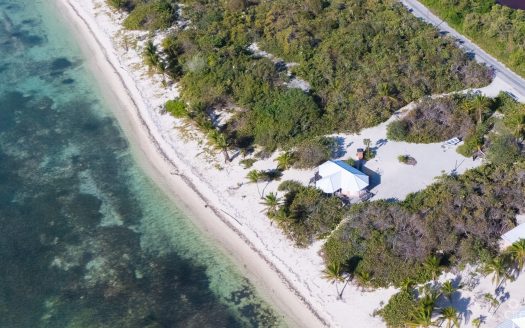 LITTLE CAYMAN LAND WITH BEACHFRONT COTTAGE