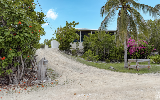 LITTLE CAYMAN OCEAN VIEW RESIDENTIAL HOME W/ BEACHFRONT LOT JUST SHY OF 1 ACRE