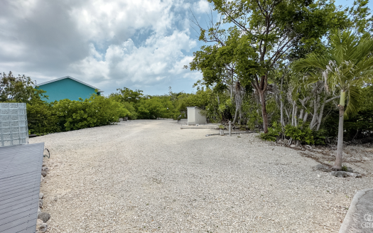LITTLE CAYMAN OCEAN VIEW RESIDENTIAL HOME W/ BEACHFRONT LOT JUST SHY OF 1 ACRE